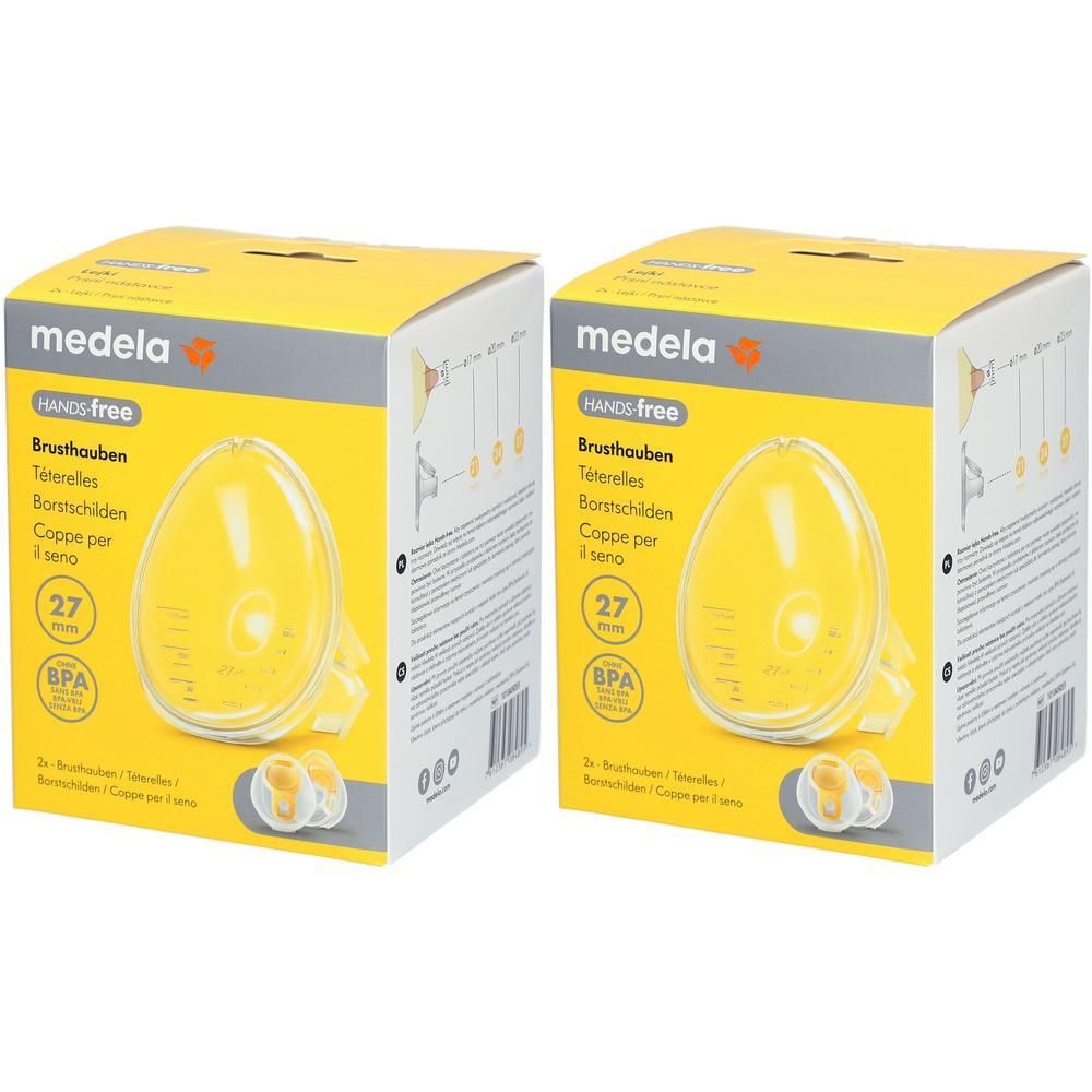 Zwei gelbe Kartons. Aufschrift: Medela, Hands free, Brusthauben, 27 mm, BPA-frei. Enthält zwei Brusthauben.