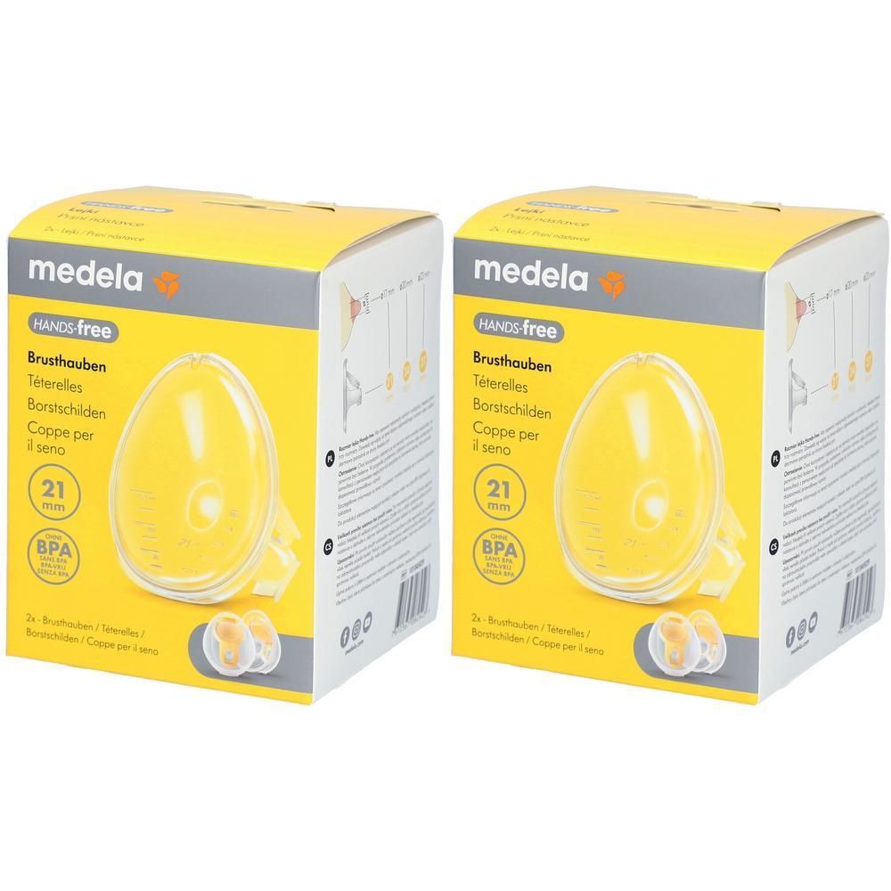 Zwei gelbe Kartons mit Brusthauben. Aufdruck: Medela, Hands-free, 21 mm, BPA. Sichtbare Brusthauben.