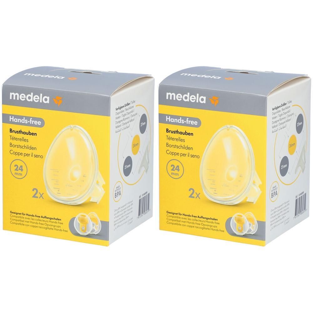 Zwei Kartons mit Brusthauben. Aufschrift: Medela, Hands-free, 24 mm, 2x. Gelbe Brusthauben in den Kartons sichtbar.