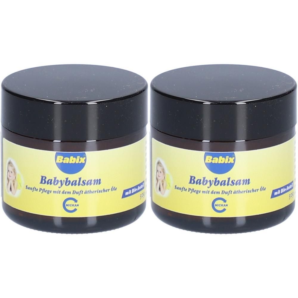 Zwei runde Tiegel mit schwarzem Deckel. Auf dem Etikett steht "Babix Babybalsam". Gelbes Etikett mit Bild eines Kindes. Text in deutscher Sprache.