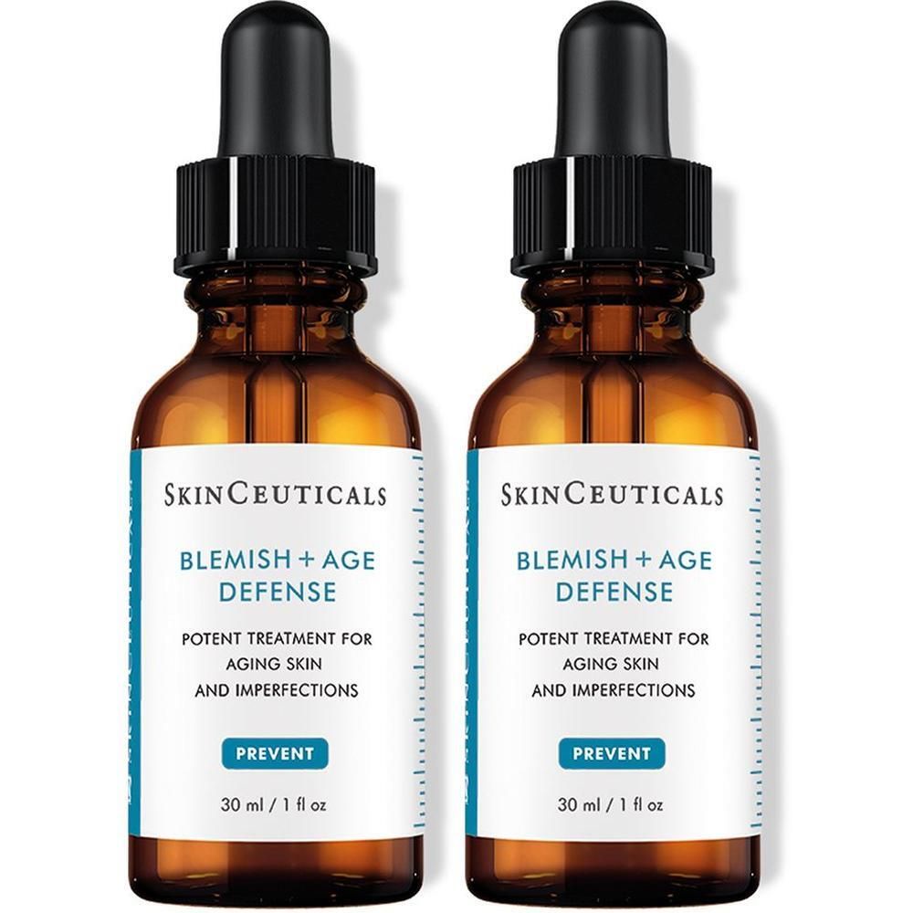 Zwei braune Glasflaschen mit schwarzen Pipetten. Aufkleber mit Text: Blemish + Age Defense. 30 ml / 1 fl oz.