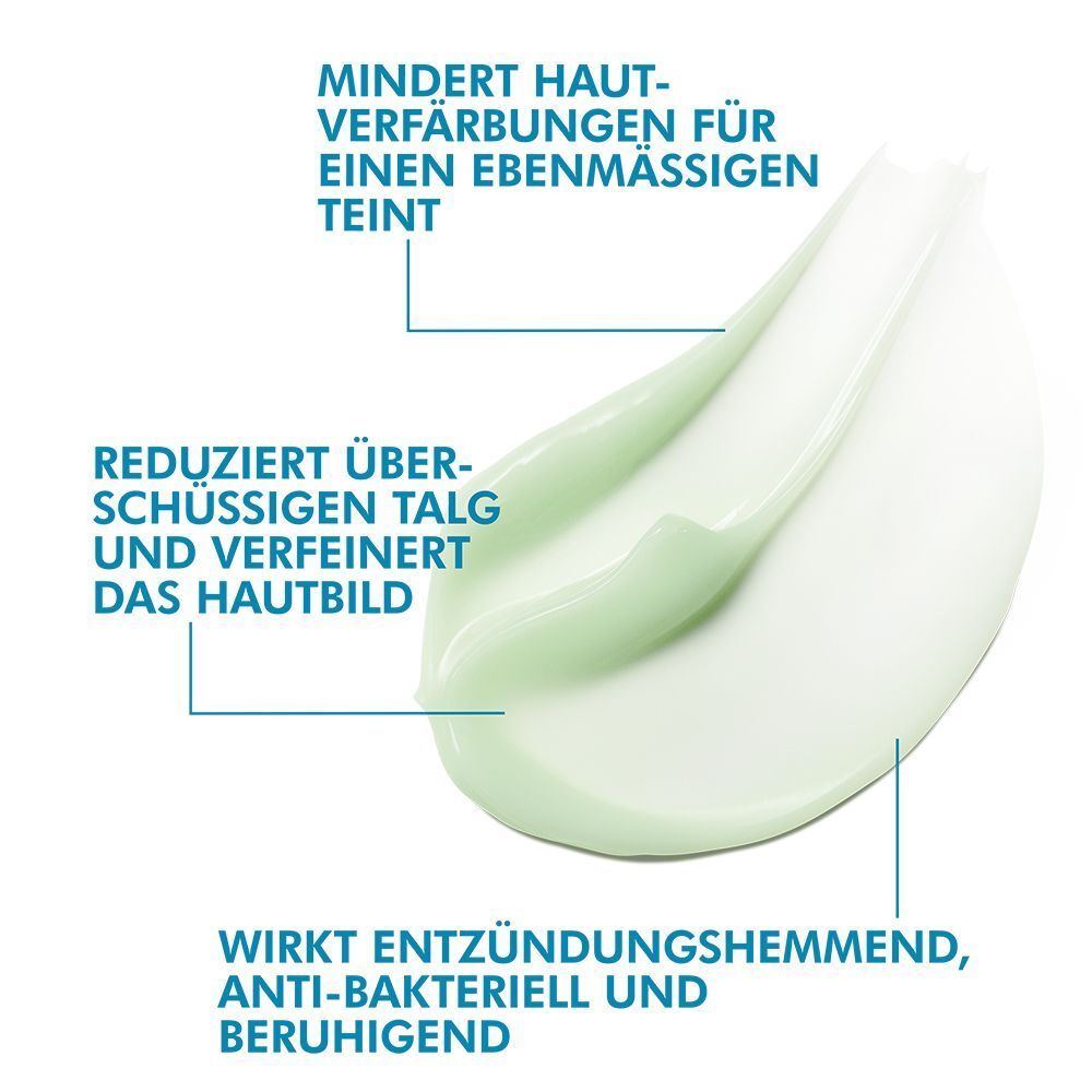Grüne Creme-Textur mit blauen Pfeilen. Text: Reduziert überschüssigen Talg und verfeinert das Hautbild.