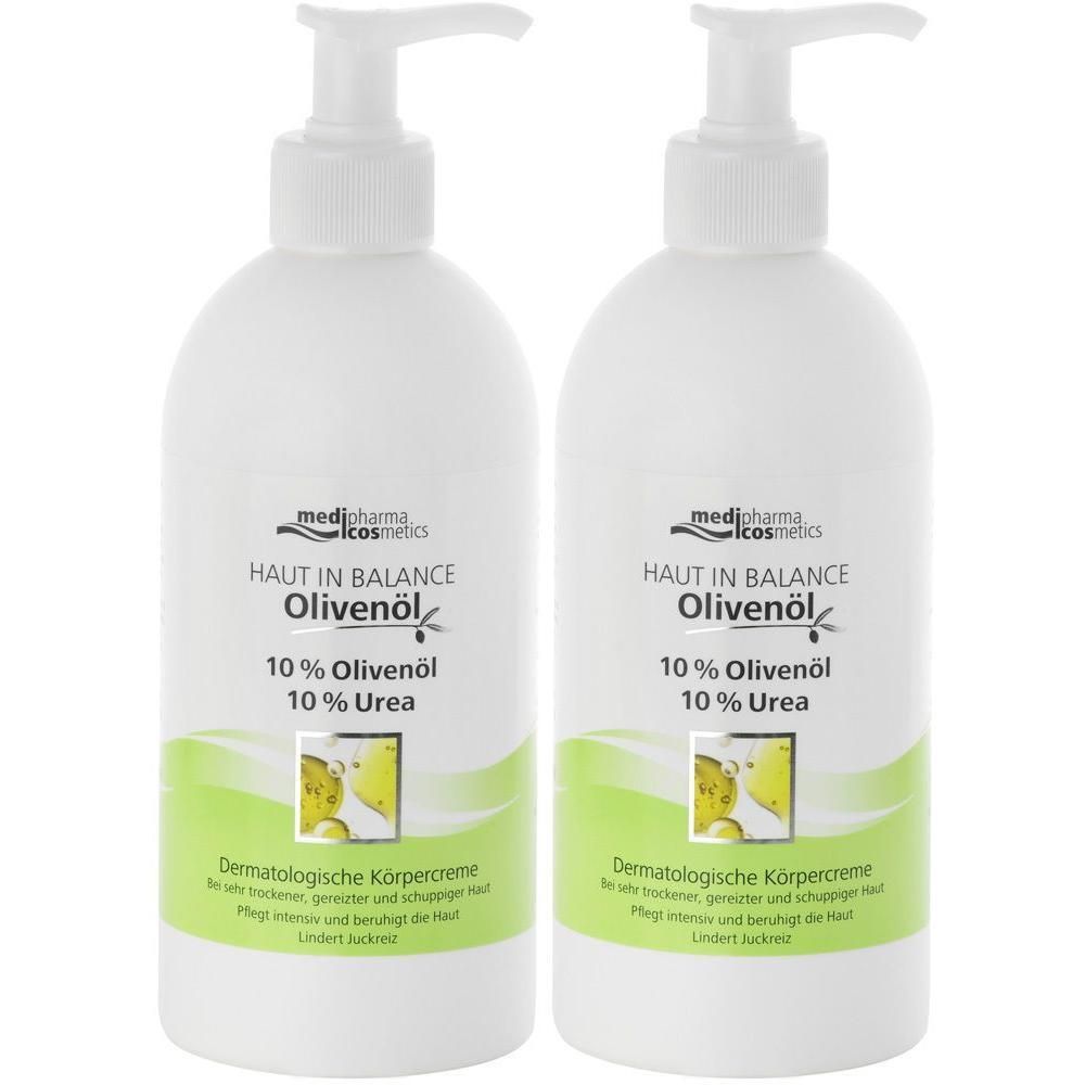 Zwei weiße Flaschen mit Pumpverschluss. Aufschrift: HAUT IN BALANCE Olivenöl, 10% Olivenöl, 10% Urea. Dermatologische Körpercreme.