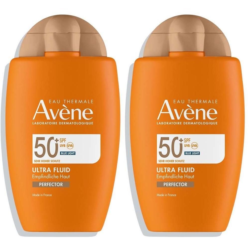 Zwei orangefarbene Flaschen mit braunen Deckeln. Aufschrift: Avène, SPF 50+, Ultra Fluid, Perfector.