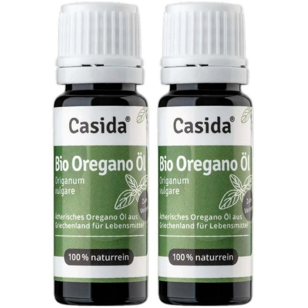 Zwei Flaschen Casida Bio Oregano Öl. Grüne Etiketten, weiße Deckel. 100% naturrein.