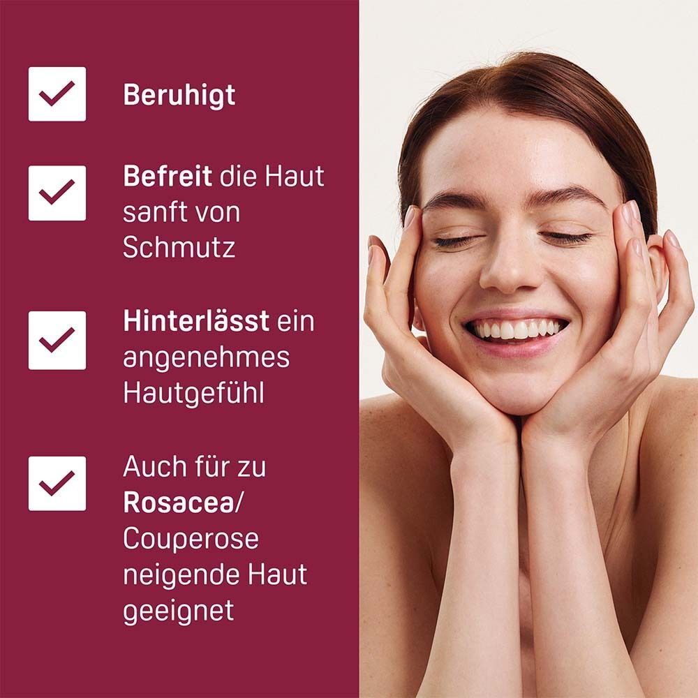 Frau mit geschlossenen Augen, Hände im Gesicht. Text: Beruhigt, befreit sanft von Schmutz, angenehmes Hautgefühl, auch für Rosacea.