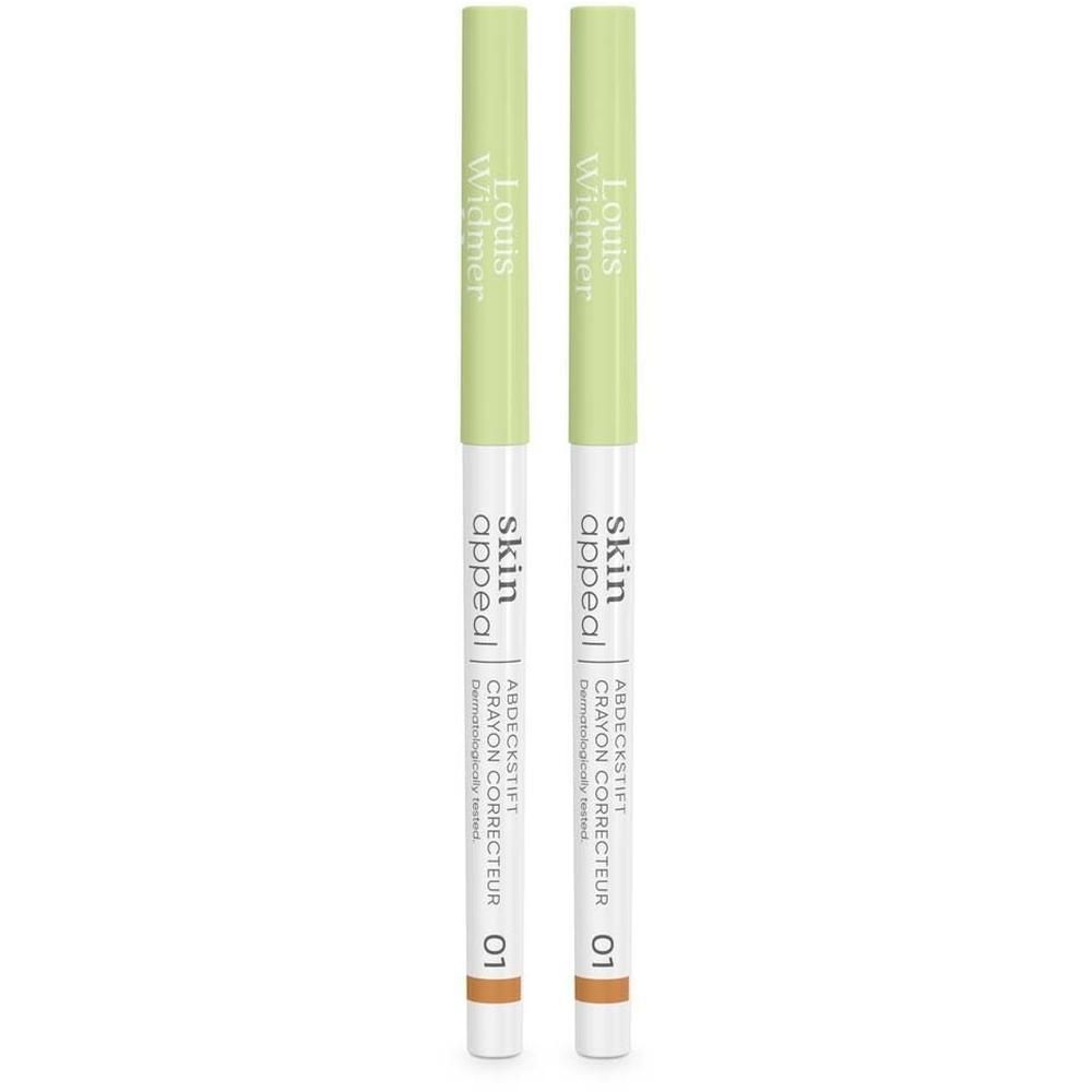 Zwei Skin Appeal Abdeckstifte, weiß-grün, mit brauner Spitze. Aufschrift: Louis Widmer, Skin Appeal, Crayon Correcteur 01.