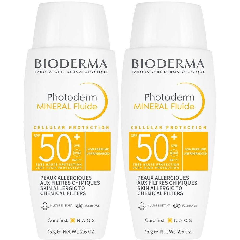 Zwei weiße Flaschen BIODERMA Photoderm Mineral Fluide SPF 50+. Gelbe Schrift und Logos. Text: Peaux allergiques aux filtres chimiques.