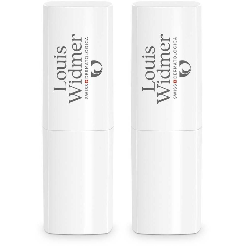 Zwei weiße Lippenpflegestifte. Aufschrift: Louis Widmer, Swiss Dermatologica.