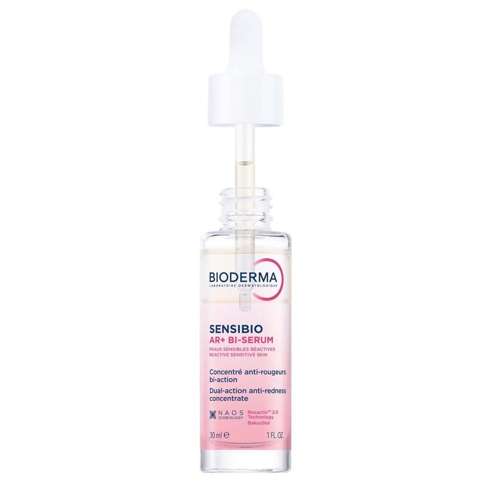 Eine Flasche Sensibio AR+ Bi-Serum mit geöffneter Pipette. Klare Glasflasche mit weißem Deckel. Rosa Etikett mit Produktinformationen.
