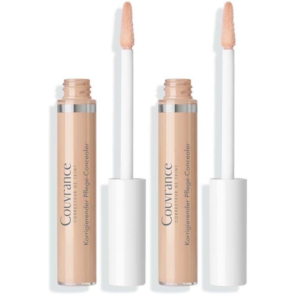 Zwei Concealer-Tuben mit Applikatoren. Aufschrift: Couvrance, Korrigierender Pflege-Concealer. Beige Farbton.
