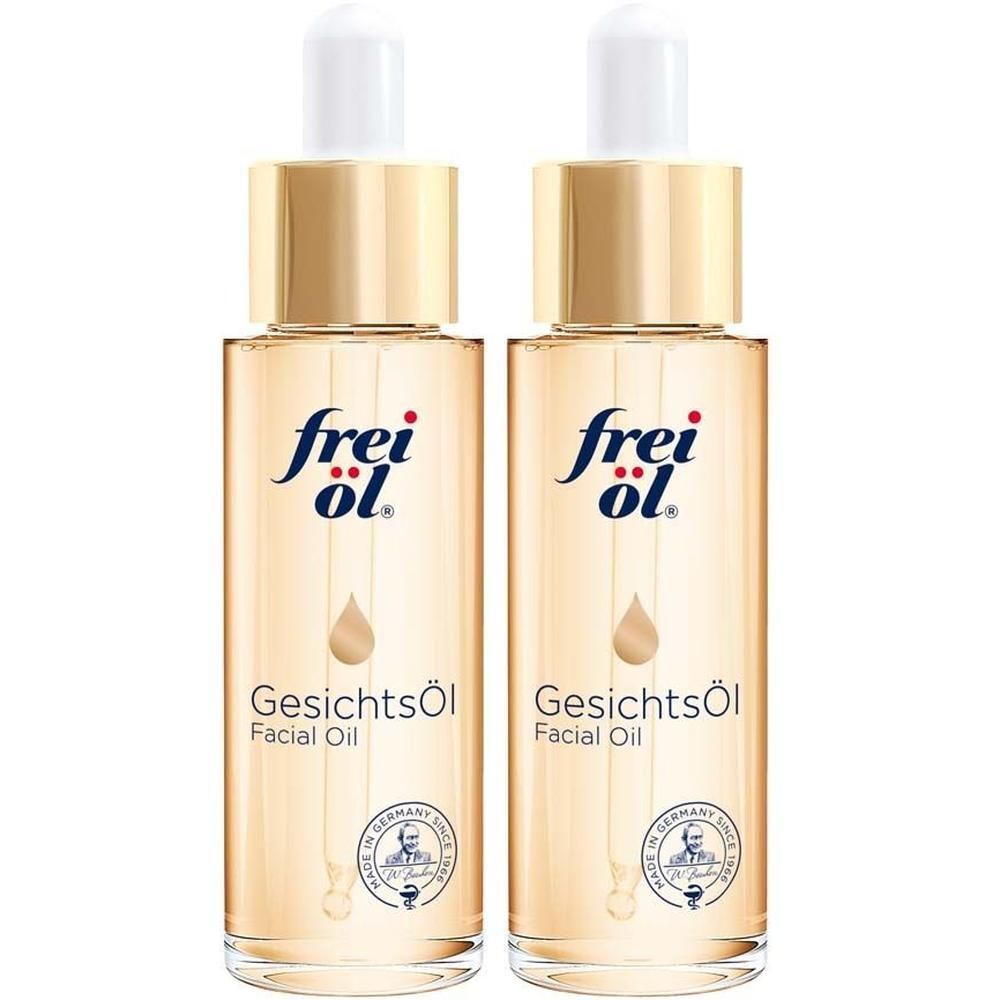 Zwei Flaschen Gesichtsöl mit goldenen Verschlüssen. Aufschrift: frei öl. Tropfenförmiges Design. Klarer Inhalt.