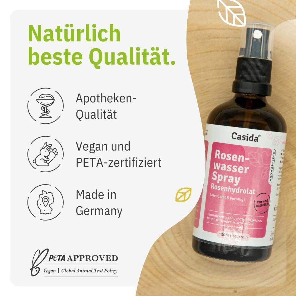 Produktflasche mit Text: Rosenwasser Spray. Siegel: Apotheken-Qualität, Vegan und PETA-zertifiziert, Made in Germany. PETA-Logo.