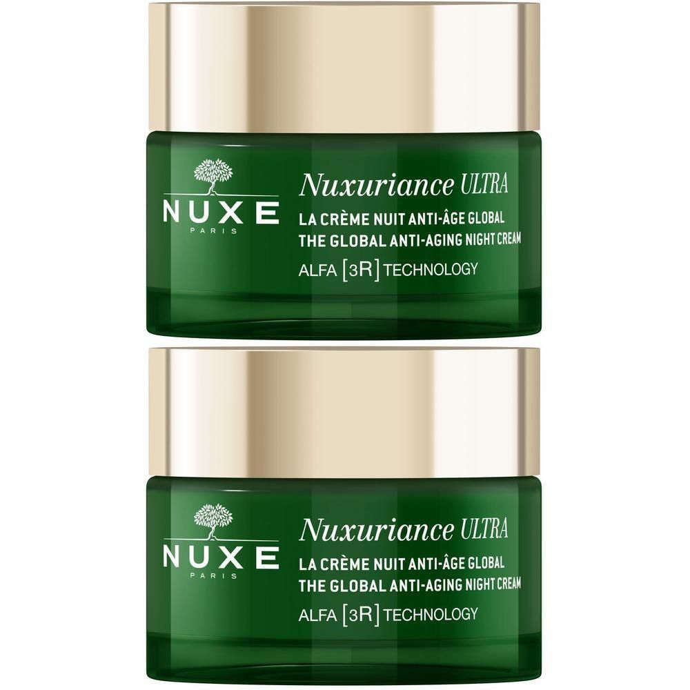 Zwei grüne Tiegel mit goldfarbenen Deckeln. Aufschrift: NUXE, Nuxuriance Ultra, The Global Anti-Aging Night Cream, ALFA [3R] TECHNOLOGY.