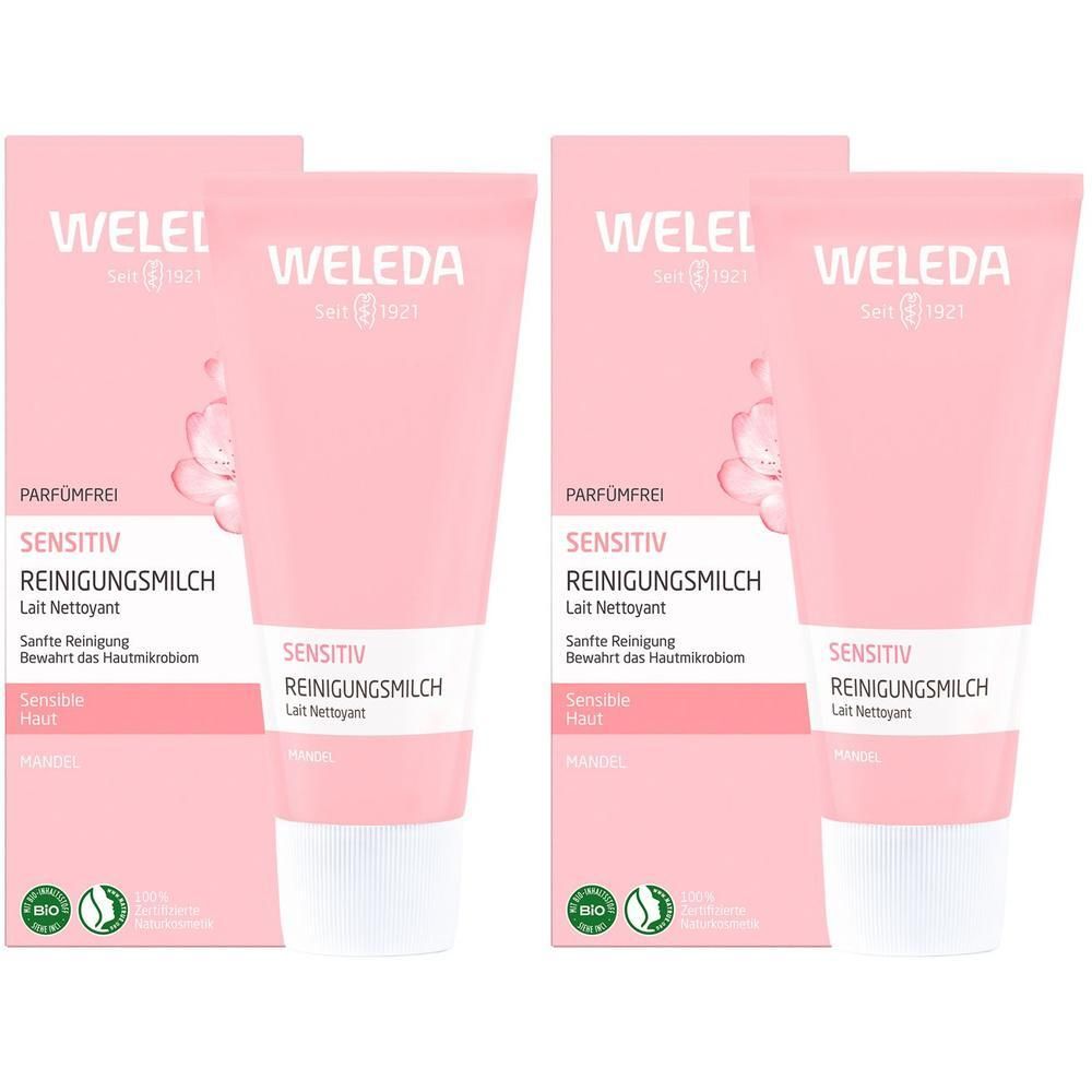 Zwei Tuben Reinigungsmilch mit Verpackung. Rosa Tuben mit weißem Deckel. Aufdruck: WELEDA, Sensitiv Reinigungsmilch.