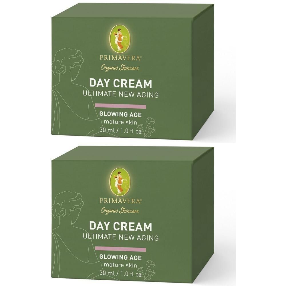 Zwei grüne Faltschachteln mit Aufschrift DAY CREAM, PRIMAVERA Organic Skincare. Text: ULTIMATE NEW AGING, GLOWING AGE, mature skin, 30 ml / 1.0 fl oz.