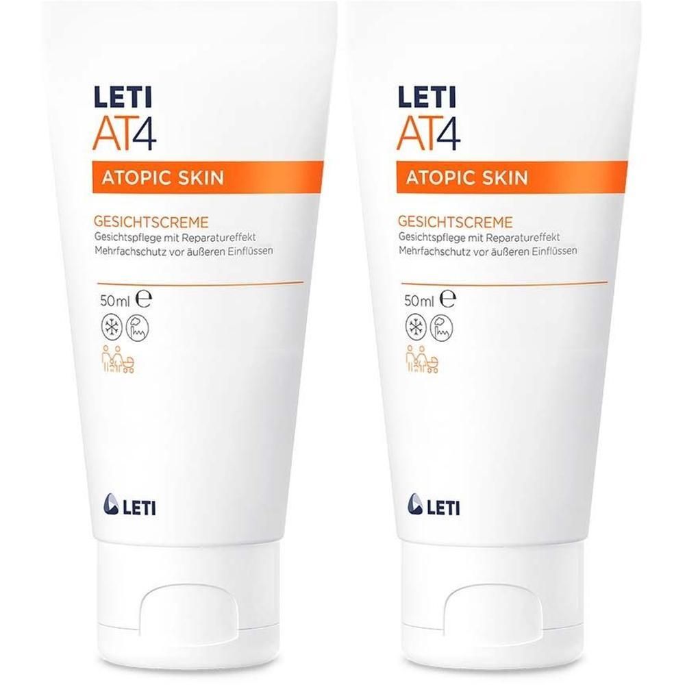 Zwei Tuben LETI AT4 Gesichtscreme. Weiße Tuben mit orangefarbenen Akzenten und Produktinformationen. LETI-Logo unten.