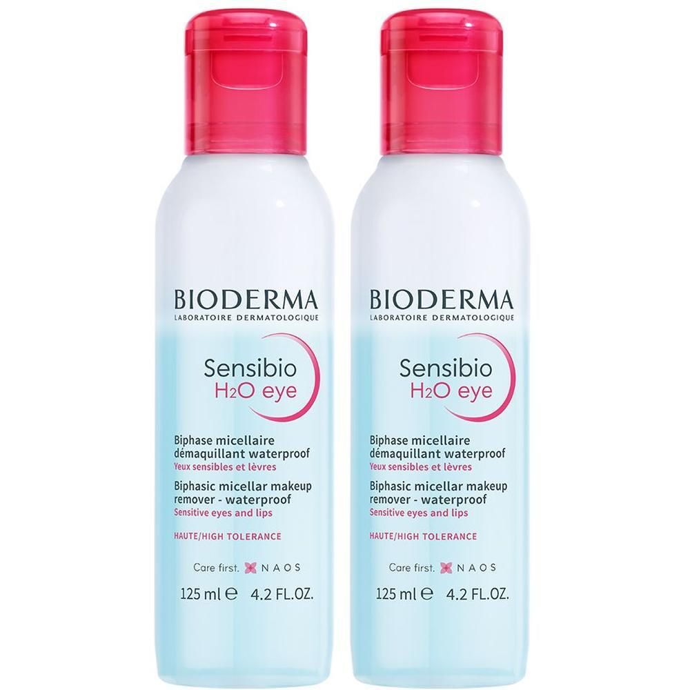 Zwei Flaschen BIODERMA Sensibio H2O eye. Weiße Flaschen mit rosa Deckel. Aufschrift: Biphase micellaire, waterproof.