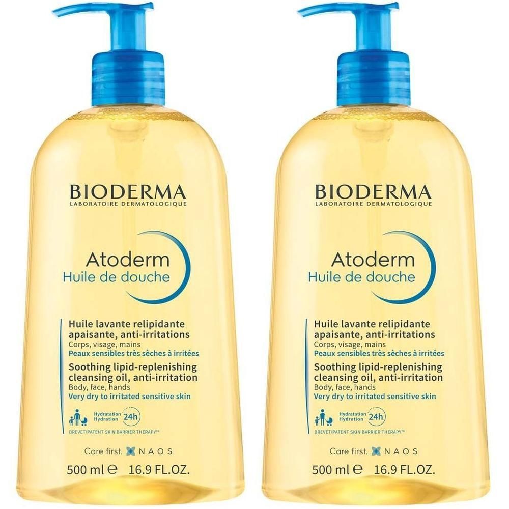 Zwei Flaschen BIODERMA Atoderm Huile de Douche mit blauen Pumpaufsätzen. Aufschrift: Huile de douche, 500 ml.