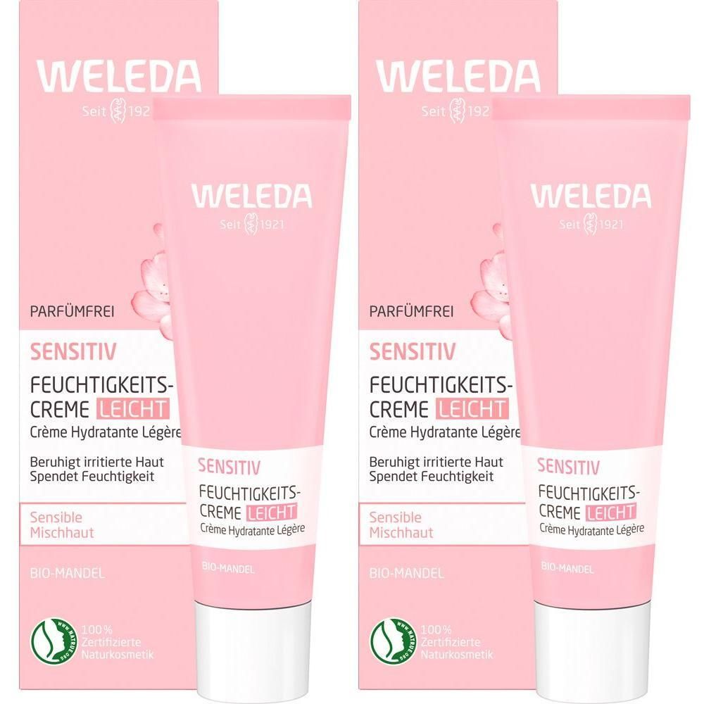 Zwei Tuben Weleda Sensitiv Feuchtigkeitscreme Leicht. Rosa Tuben mit weißer Schrift. Verpackung mit Produktnamen.