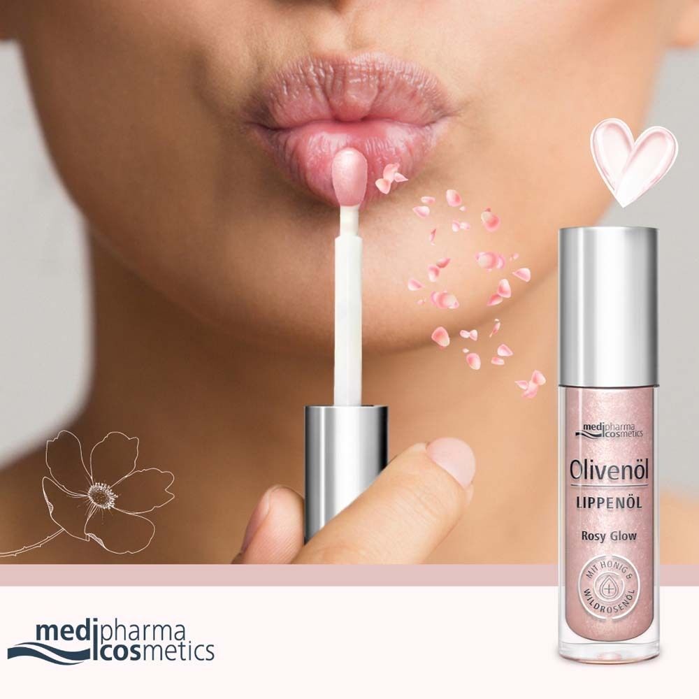 Lippenöl-Flakon mit Rosy Glow. Rosa Flüssigkeit in Glasflasche mit silbernem Deckel. Applikator wird auf Lippen aufgetragen.