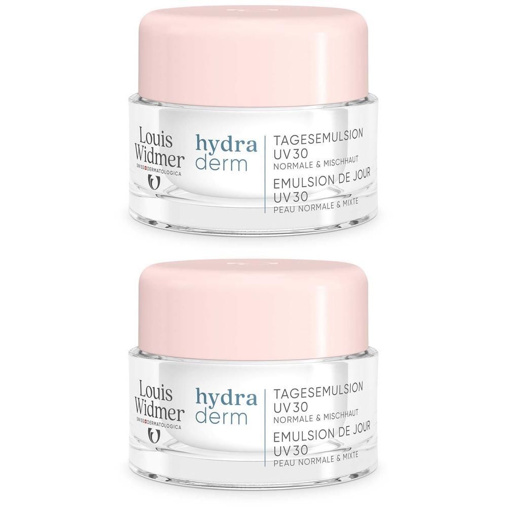 Zwei Tiegel hydra derm Tagesemulsion UV 30. Rosa Deckel, transparente Gläser. Produktbeschriftung: Louis Widmer, hydra derm, UV 30.