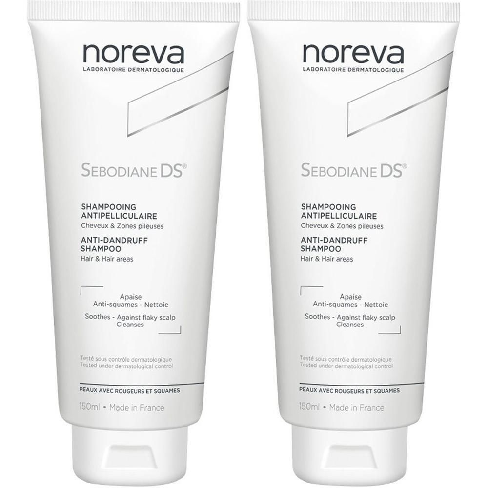 Zwei weiße Tuben mit Shampoo. Aufschrift: Noreva, Sebodiane DS, Anti-Schuppen Shampoo. Französische und englische Texte.