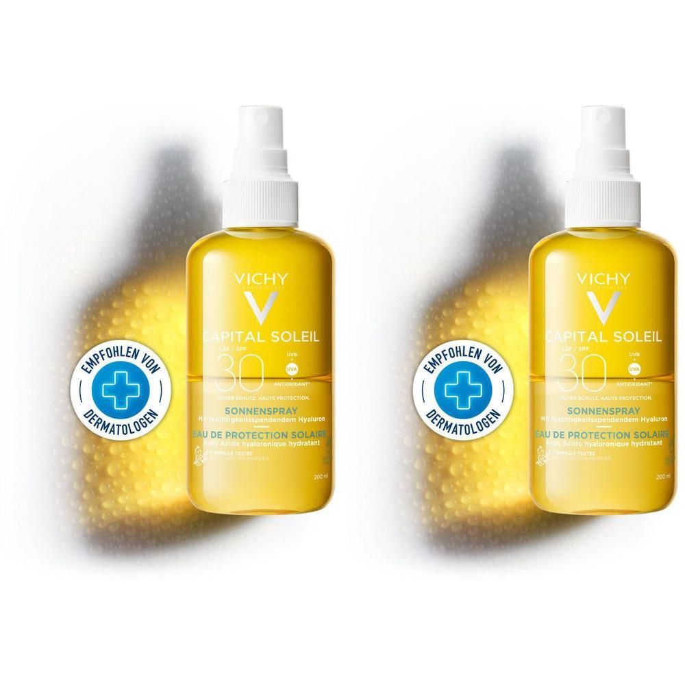 Zwei gelbe Sonnenspray-Flaschen mit weißem Sprühkopf. Aufschrift: Vichy Capital Soleil LSF 30. Empfohlen von Dermatologen.