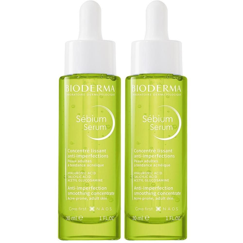 Zwei grüne Flaschen mit weißem Deckel. Aufschrift: BIODERMA, Sébium Serum. Anti-Unreinheiten, glättendes Konzentrat. 30 ml.