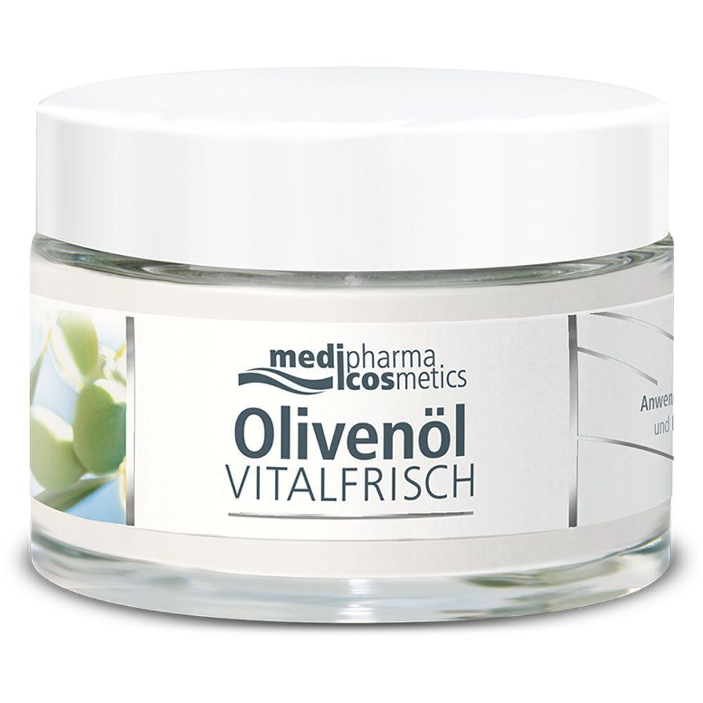 Runder Glastiegel mit weißem Deckel. Aufschrift: medi-pharma cosmetics, Olivenöl VITALFRISCH. Etikett mit Olivenzweig-Abbildung.