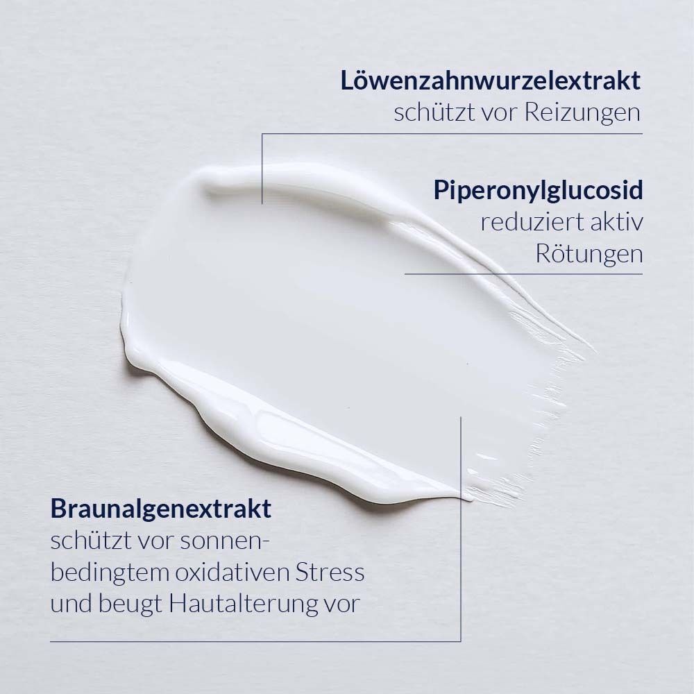 Nahaufnahme einer Creme mit drei hervorgehobenen Inhaltsstoffen: Löwenzahnextrakt, Piperonylglucosid, Braunalgenextrakt. Text und Pfeile.