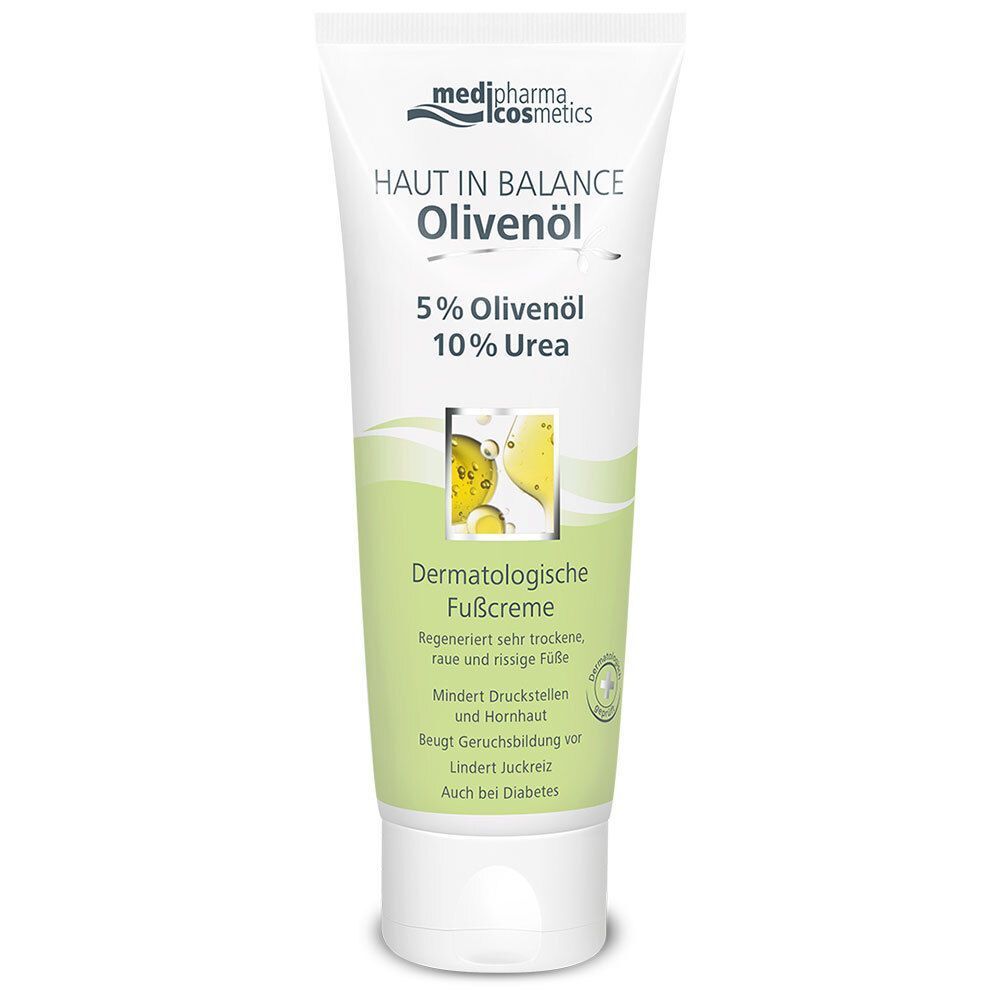 Weiße Tube mit grünem Aufdruck. HAUT IN BALANCE Olivenöl, 5% Olivenöl, 10% Urea. Dermatologische Fußcreme. Mit weißem Deckel.