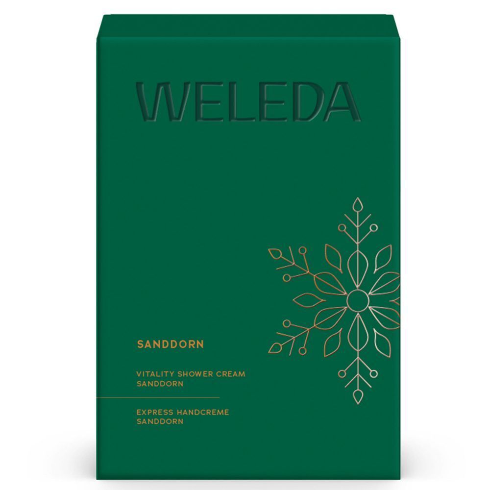 Grüne Geschenkbox mit dem Schriftzug WELEDA. Enthält Produktnamen und dekoratives goldenes Design.