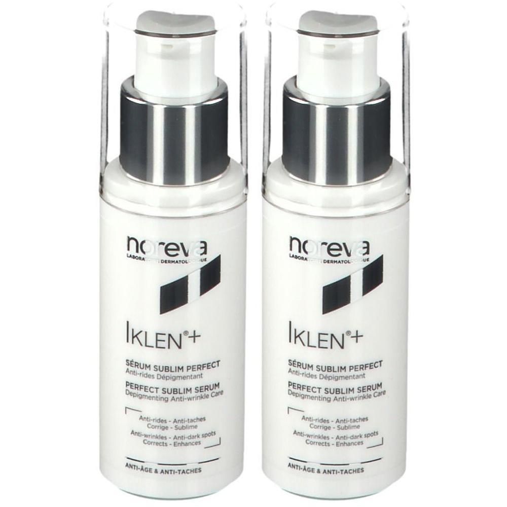 Zwei weiße Flaschen mit silbernen Pumpköpfen. Auf jeder Flasche steht "noreva" und "Iklen+". Text: Serum Sublim Perfect, Anti-Age & Anti-Flecken.