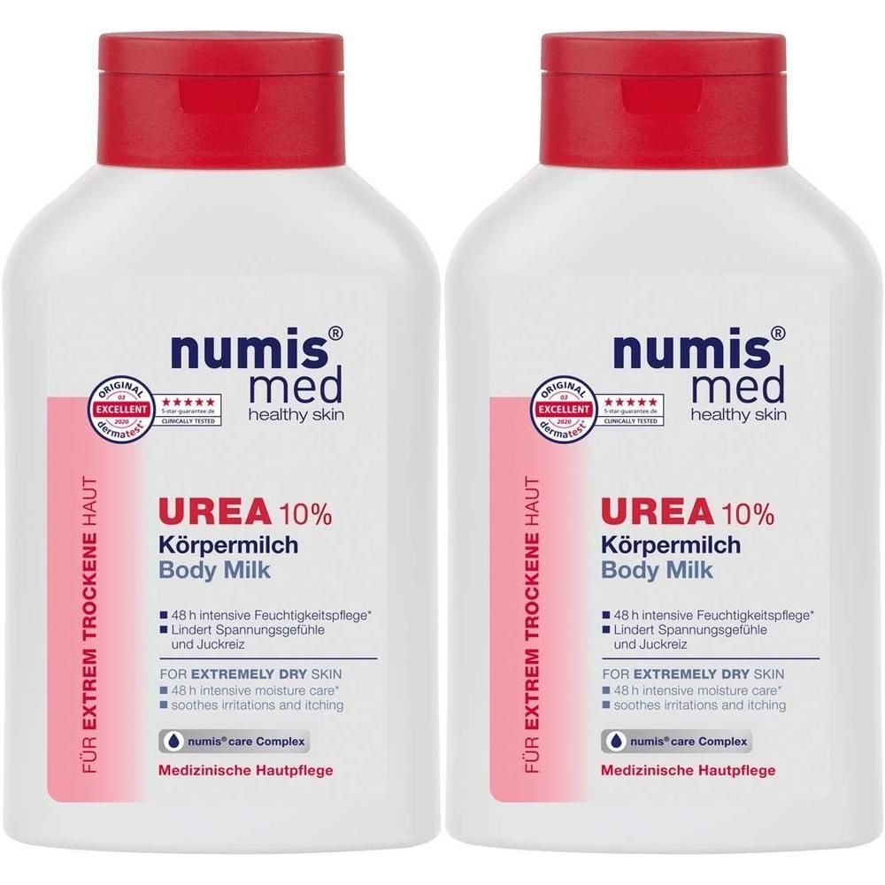 Zwei weiße Flaschen mit rotem Deckel. Aufschrift: numis med, Urea 10% Körpermilch. Für extrem trockene Haut. Medizinische Hautpflege.
