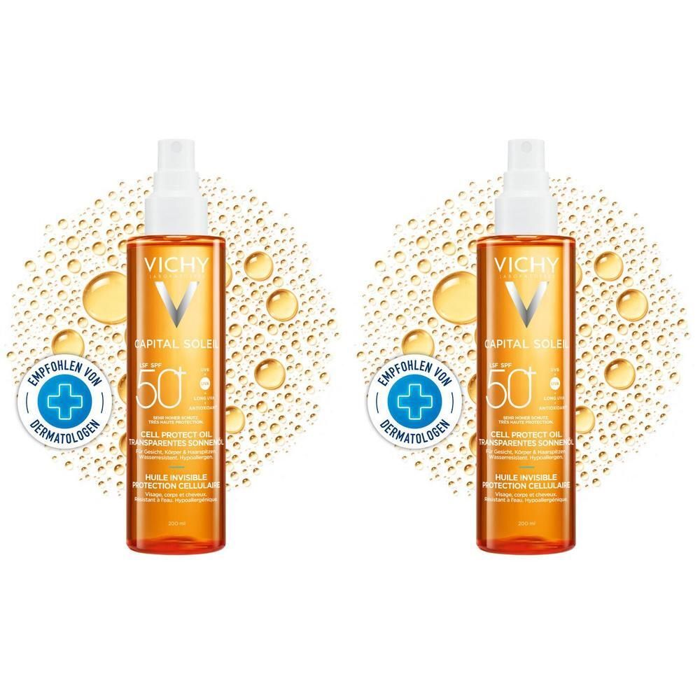 Zwei Flaschen VICHY CAPITAL Soleil Cell Protect Oil LSF 50. Orangefarbene Flüssigkeit in Sprühflaschen mit weißem Deckel. Aufschrift: LSF 50.