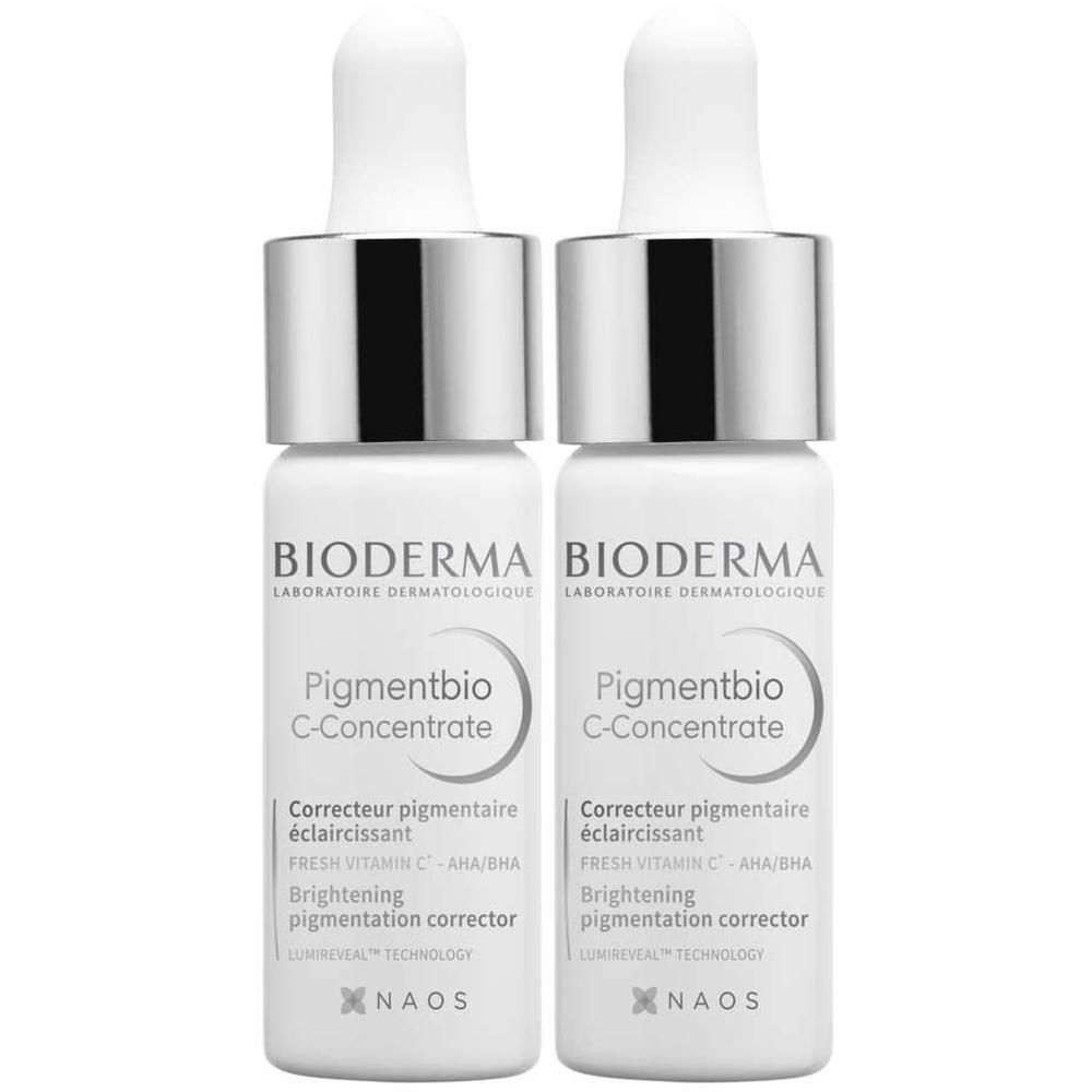 Zwei Flaschen BIODERMA Pigmentbio C-Concentrate Serum. Weiße Flaschen mit silbernen Verschlüssen und Pipetten.