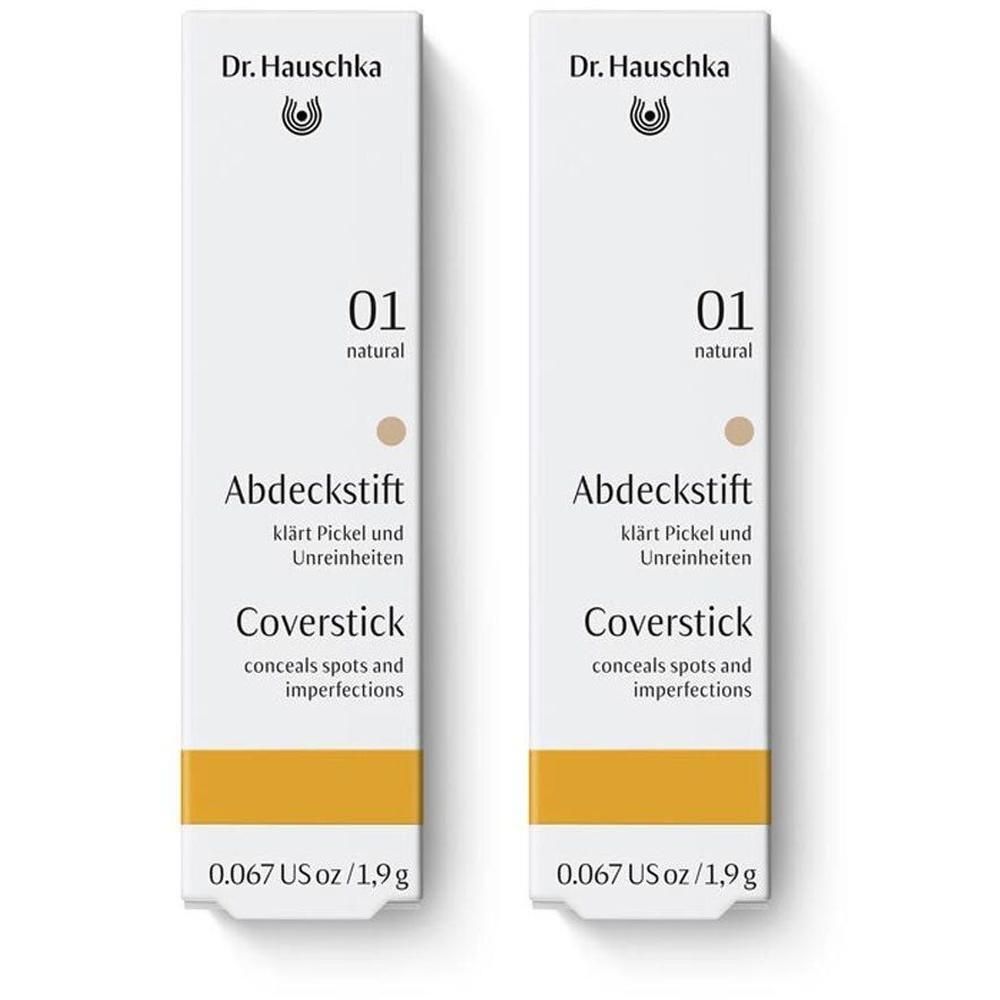 Zwei weiße Verpackungen mit Produktinformationen. Oben: Dr. Hauschka Logo. Text: Abdeckstift 01 natural, Coverstick. Unten: 0.067 US oz / 1,9 g.