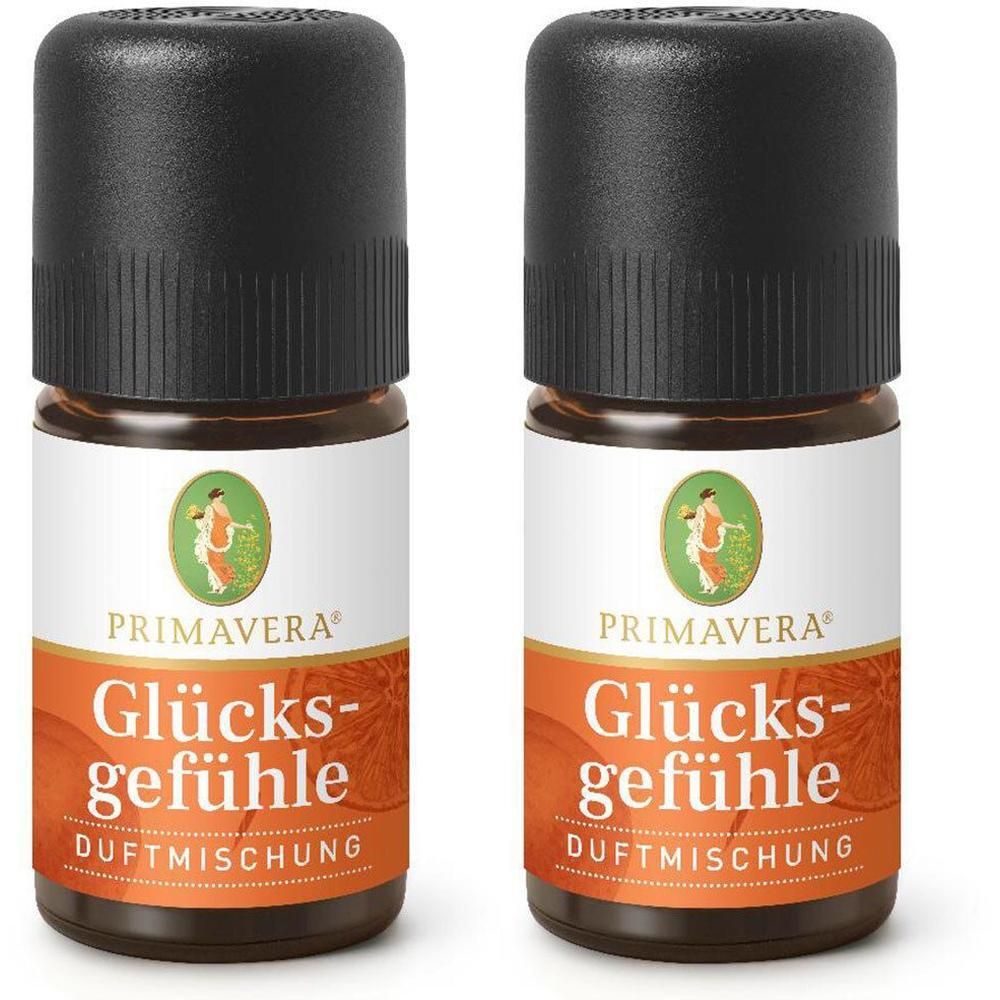 Zwei braune Glasflaschen mit schwarzem Deckel. Aufschrift: GLÜCKSGEFÜHLE DUFTMISCHUNG. Marke: PRIMAVERA. Etikett mit Frau.