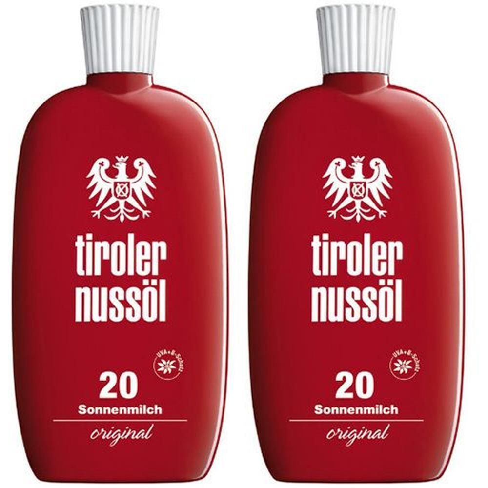 Zwei rote Flaschen mit weißem Verschluss. Aufschrift: Tiroler Nussöl, 20 Sonnenmilch original. Mit Wappen.