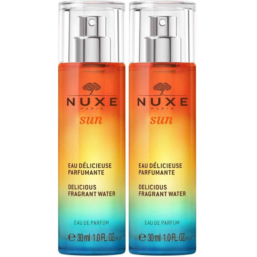 Zwei Flakons mit Sprühkopf. Farbverlauf von Blau nach Gelb und Orange. Aufschrift: NUXE Sun, Eau Délicieuse Parfumante, Delicious Fragrant Water.