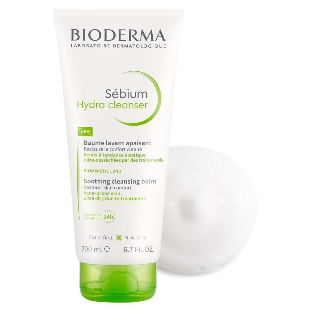 BIODERMA Sébium Hydra Cleanser Tube und Schaum. Weiße Tube mit grünen Akzenten. Schaum daneben. Text: Sébium Hydra cleanser.