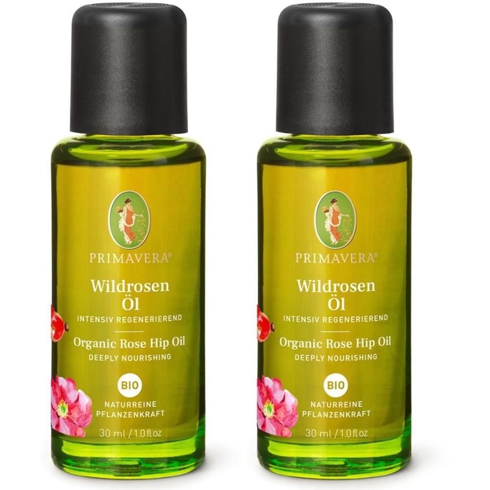 Zwei grüne Glasflaschen mit schwarzem Deckel. Aufschrift: Wildrosen Öl, Organic Rose Hip Oil, Bio. 30 ml.