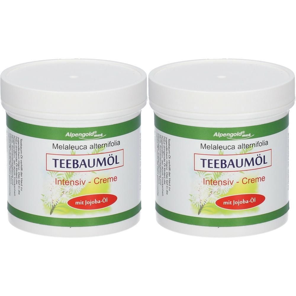 Zwei weiße Tiegel mit Deckel. Aufschrift: TEEBAUMÖL Intensiv-Creme mit Jojoba-Öl. Grün-weiße Etiketten. Marke: Alpengold.