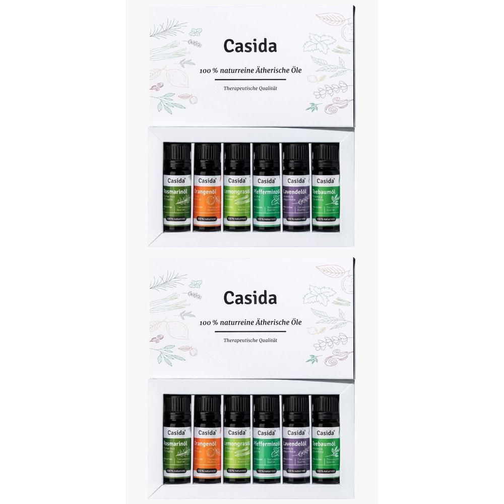 Zwei Sets Casida® ätherische Öle. Jedes Set enthält 7 Fläschchen in einer weißen Schachtel. Aufdruck: Casida, 100 % naturrein.