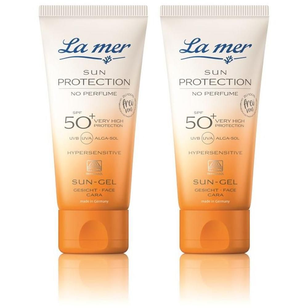 Zwei Tuben La Mer Sonnencreme LSF50+ für das Gesicht. Weiße Tube mit orangefarbenem Verschluss. Aufschrift: Sun Protection, Sun-Gel.