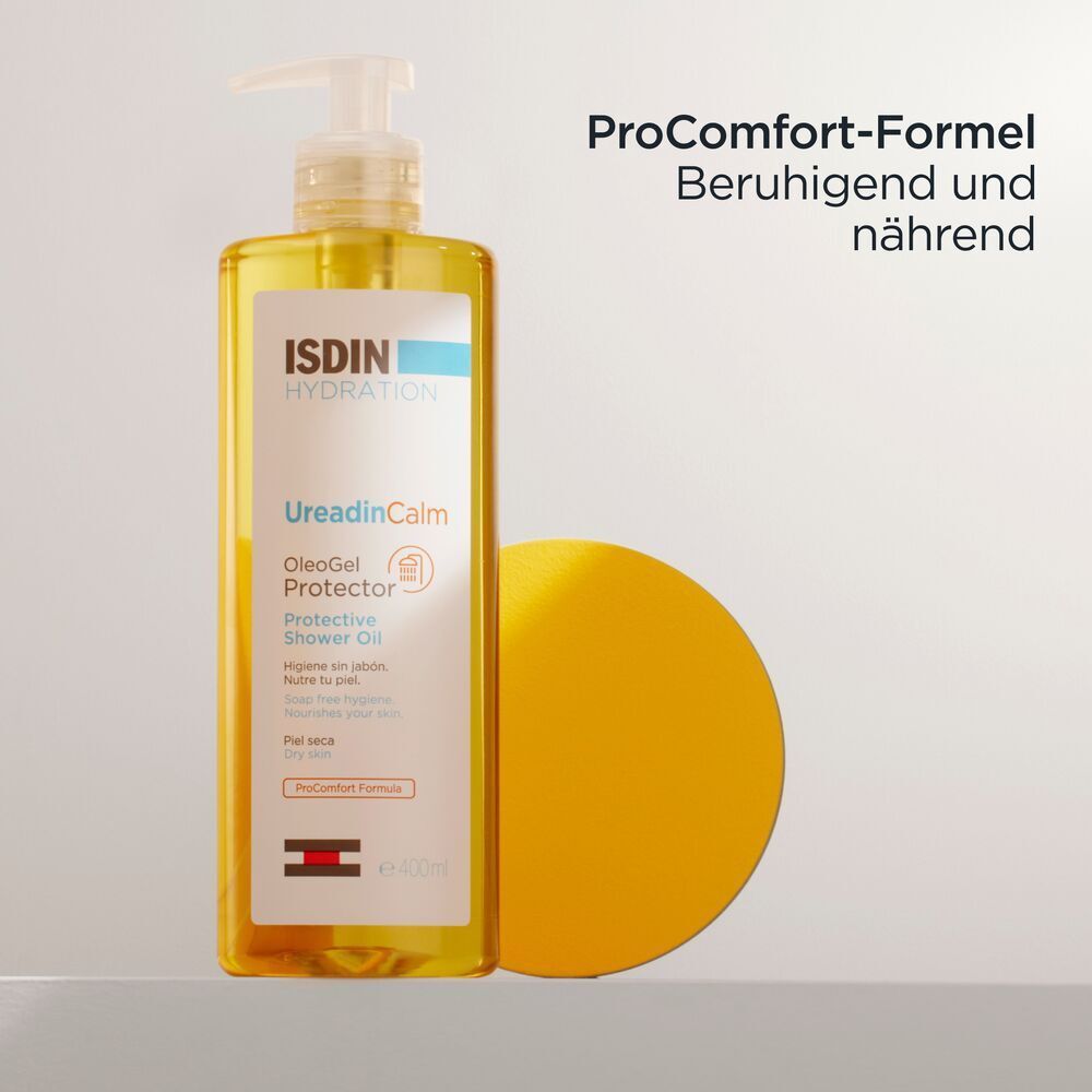 ISDIN Ureadin Calm Duschöl und gelbe Scheibe. Text: ProComfort-Formel. Beruhigend und nährend.