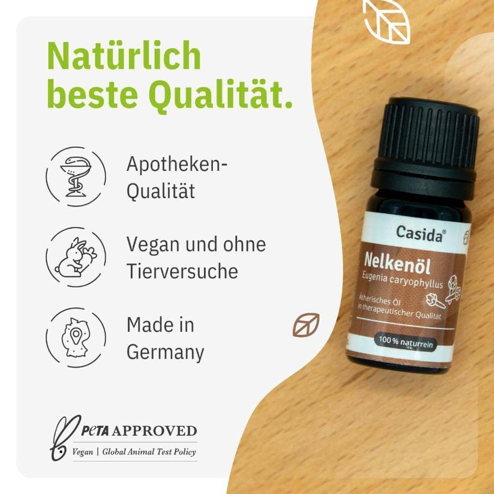 Flasche Casida® Nelkenöl auf Holz. Text: Apotheken-Qualität, Vegan und ohne Tierversuche, Made in Germany.