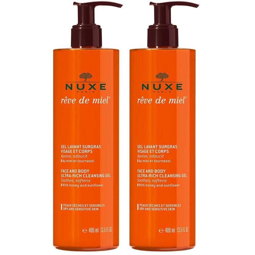 Zwei Flaschen NUXE Rêve de Miel® Duschgel. Orangefarbene Flaschen mit braunen Pumpaufsätzen. Text: Gel Lavant Surgras.