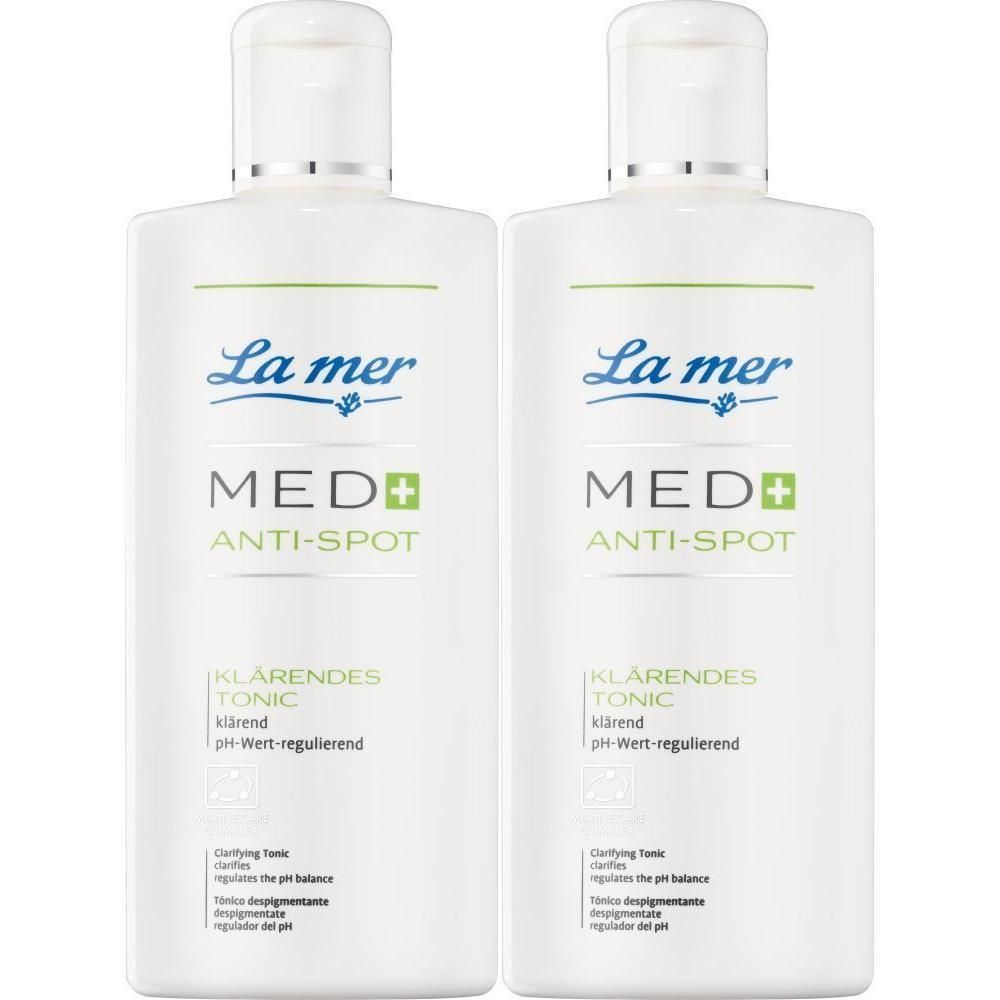 Zwei weiße Flaschen mit weißem Deckel. Aufschrift: La mer MED+ ANTI-SPOT klärendes Tonic.